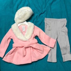 Camilla Pink fleece dress, fur hat, and gray pants